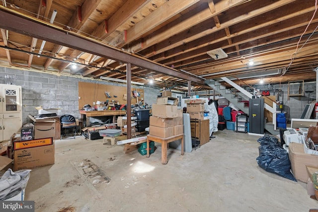 unfinished basement featuring stairway