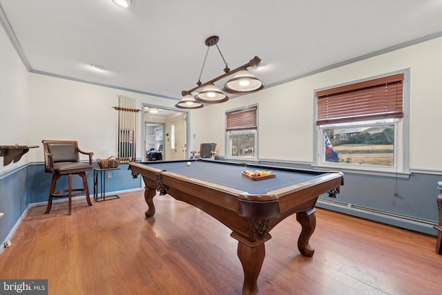 playroom featuring billiards, wood finished floors, baseboards, a baseboard radiator, and ornamental molding