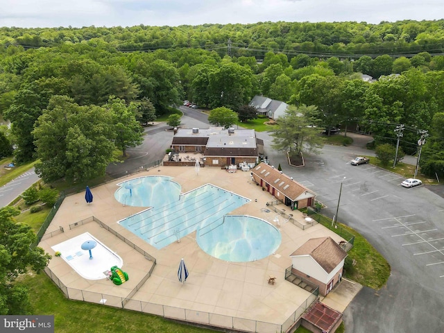 community pool featuring a forest view