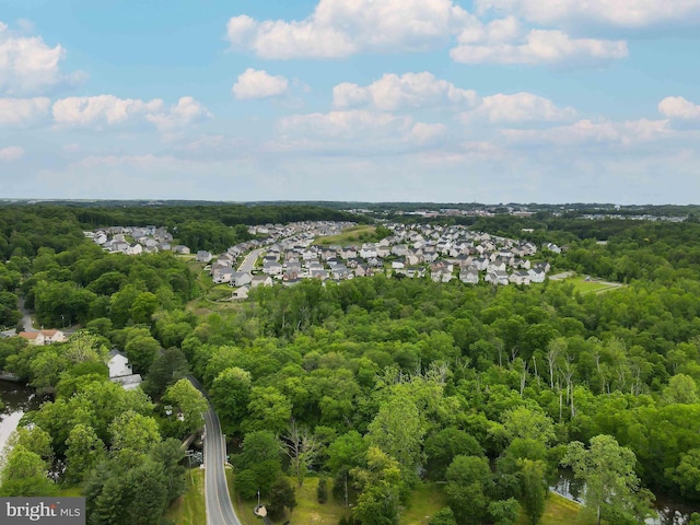 aerial view with a residential view and a view of trees