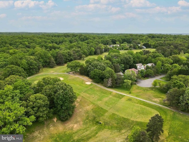 birds eye view of property with a view of trees