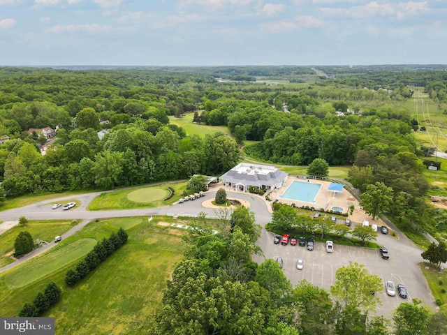 drone / aerial view featuring a view of trees