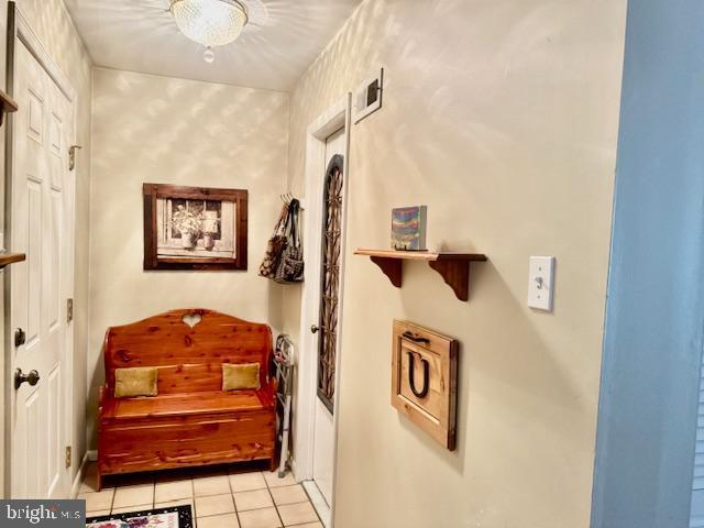 hall with light tile patterned flooring