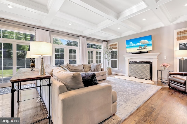 6813 Millwood Rd, Bethesda, MD 20817 - living area featuring a tiled fireplace, coffered ceiling, beamed ceiling, wood finished floors, and baseboards