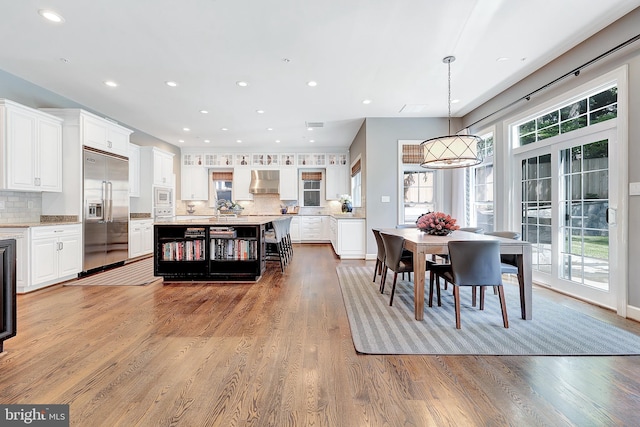 6813 Millwood Rd, Bethesda, MD 20817 - dining area with light wood-type flooring and recessed lighting