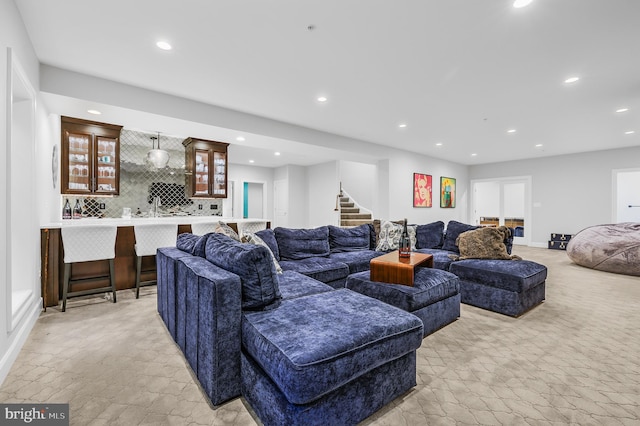 6813 Millwood Rd, Bethesda, MD 20817 - living room with bar with sink, recessed lighting, stairway, stone tile floors, and baseboards