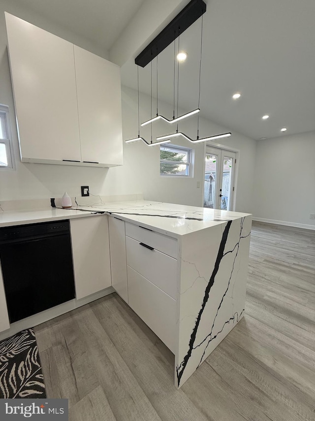 kitchen with light stone counters, dishwasher, light wood-style flooring, and white cabinetry