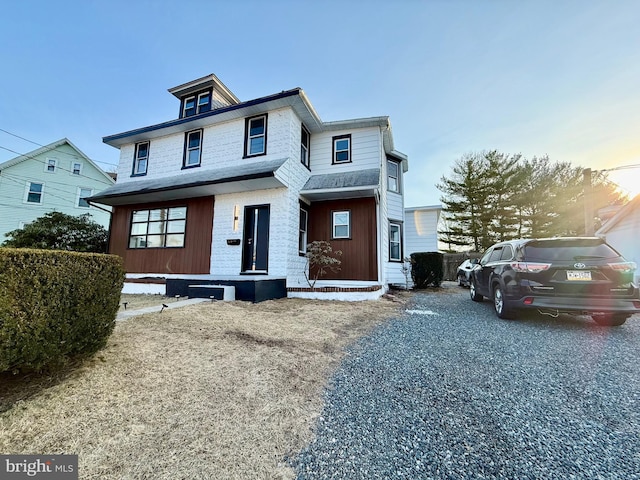 view of front of house with roof with shingles