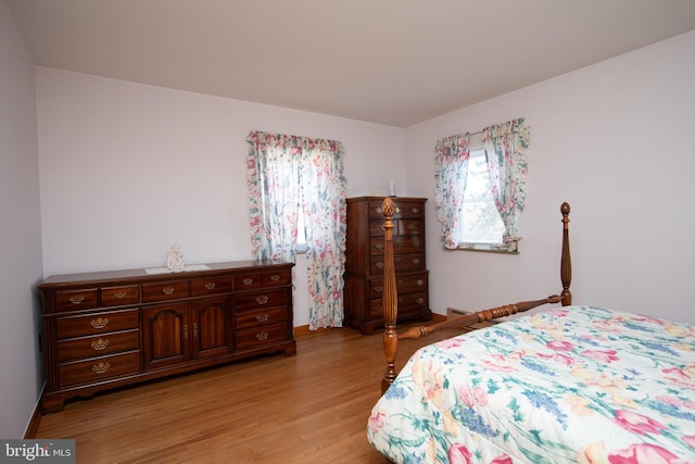 bedroom featuring light wood-style floors