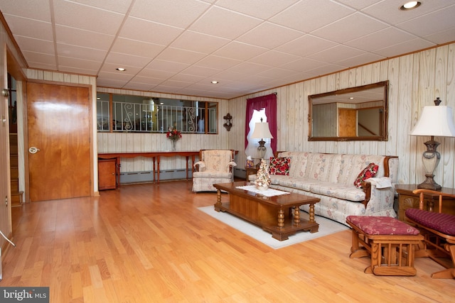 living room featuring baseboard heating and wood finished floors