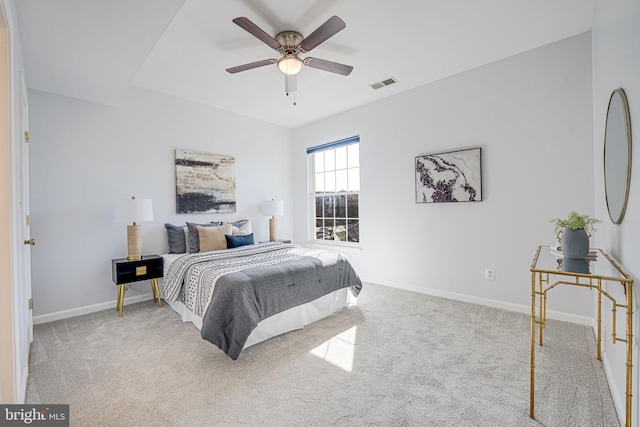 bedroom featuring visible vents, baseboards, carpet, and a ceiling fan