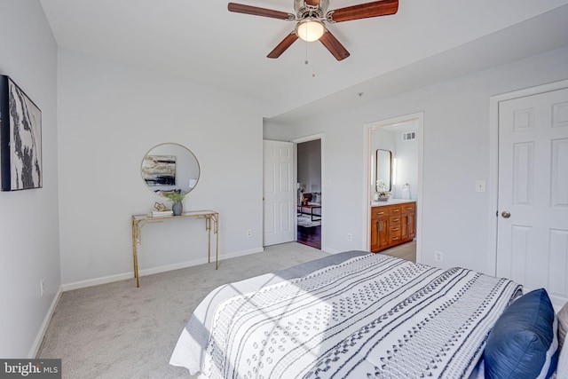 bedroom featuring visible vents, light carpet, a ceiling fan, connected bathroom, and baseboards