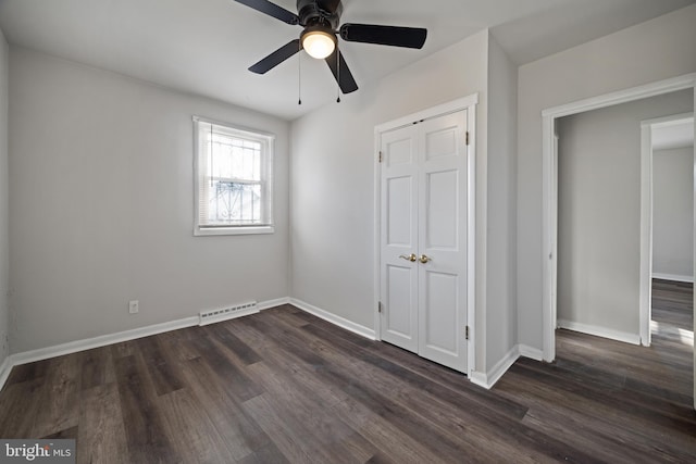 unfurnished bedroom with dark wood-type flooring, baseboards, visible vents, and ceiling fan