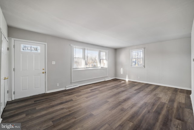 entryway featuring dark wood-type flooring, baseboards, and visible vents