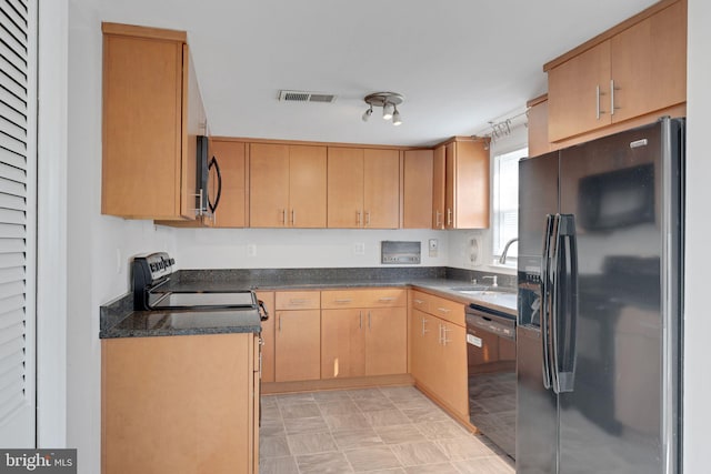 kitchen featuring a sink, visible vents, black appliances, and light brown cabinets