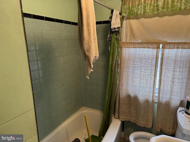 bathroom featuring toilet and shower / bathtub combination with curtain