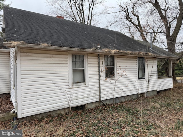 view of home's exterior featuring a shingled roof