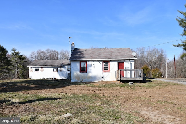 view of front of home featuring a chimney