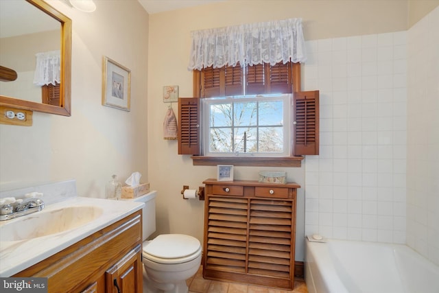 bathroom featuring toilet and vanity