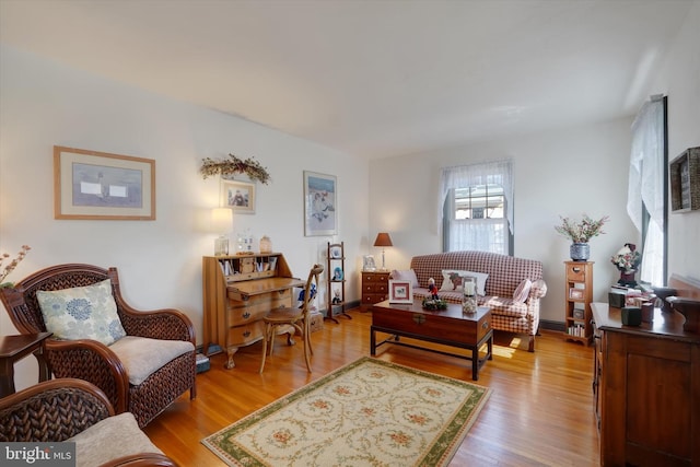 living room with wood finished floors and baseboards