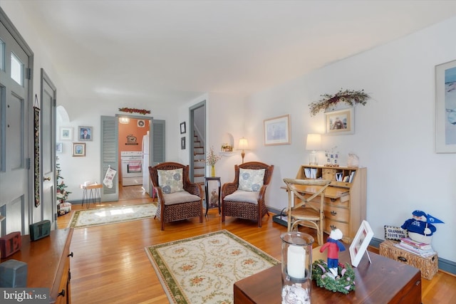 living room with baseboards and wood finished floors