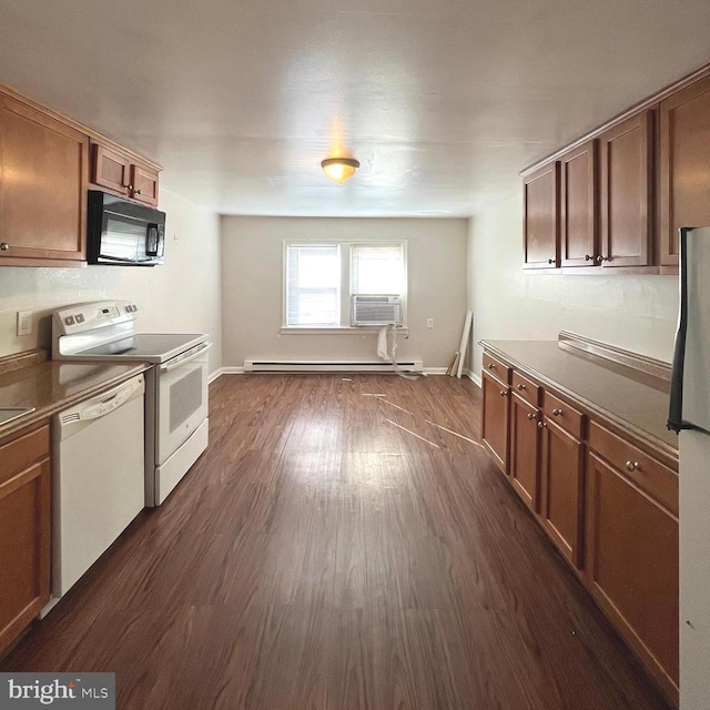 kitchen with a baseboard heating unit, baseboards, dark wood finished floors, brown cabinets, and white appliances