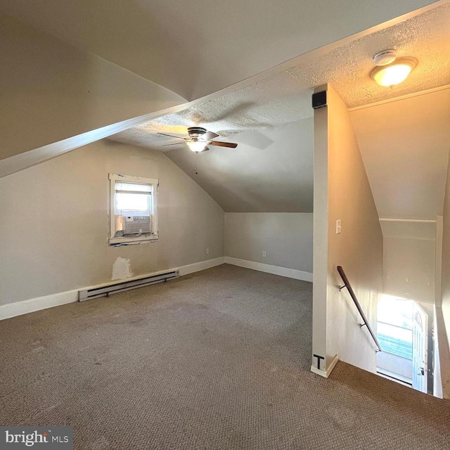 bonus room featuring baseboard heating, carpet flooring, a textured ceiling, and vaulted ceiling