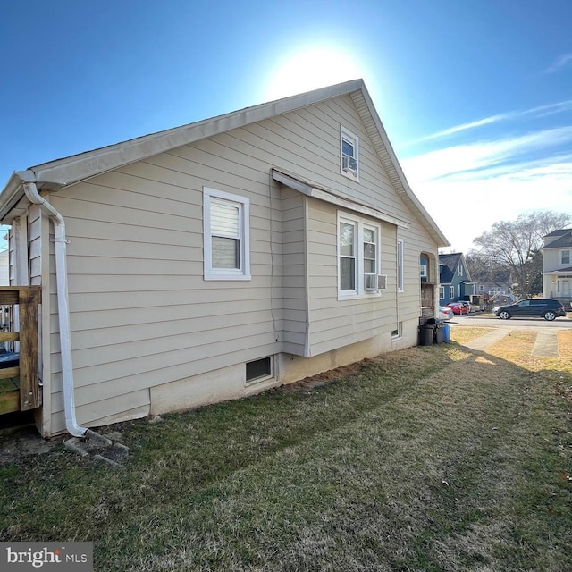 view of property exterior featuring a yard and cooling unit