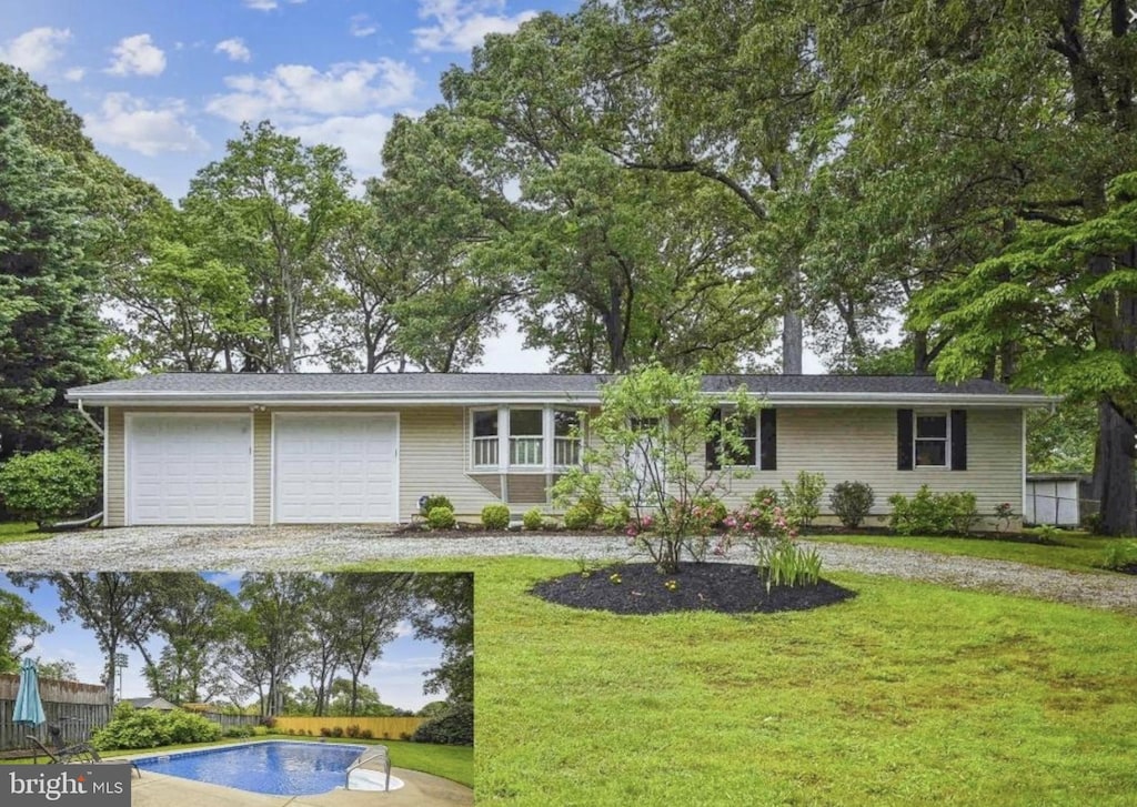 single story home featuring a front lawn, an outdoor pool, a garage, and driveway