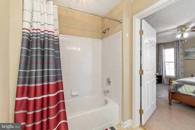 bathroom featuring shower / bath combination with curtain, a ceiling fan, ensuite bathroom, and a textured ceiling