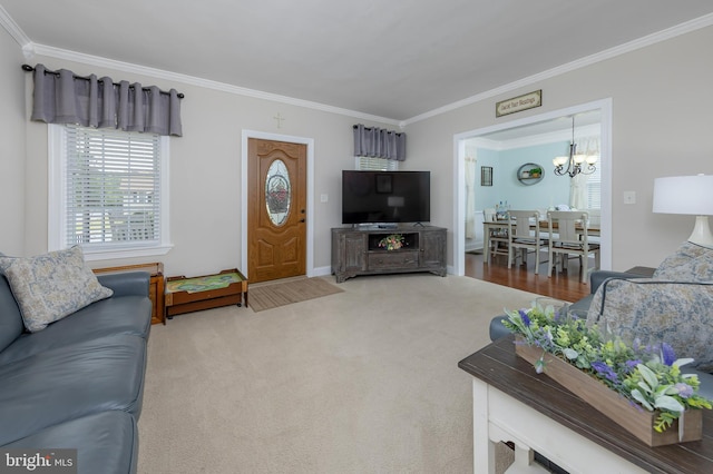 living room with carpet flooring, crown molding, and an inviting chandelier