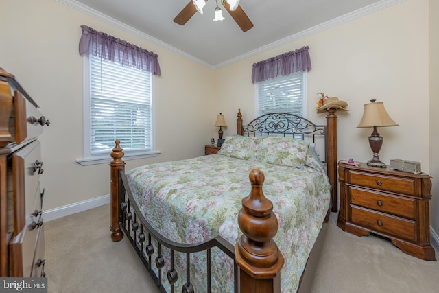 carpeted bedroom with crown molding, a ceiling fan, and baseboards