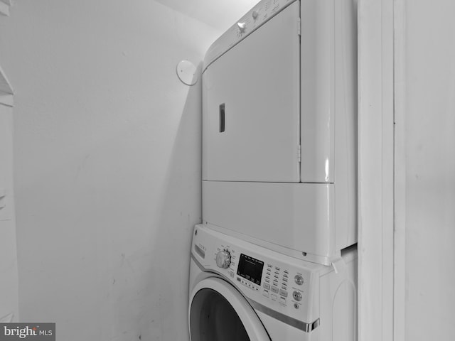 washroom with laundry area and stacked washer and dryer