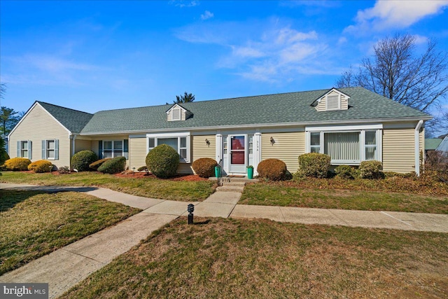 single story home featuring a front lawn and a shingled roof