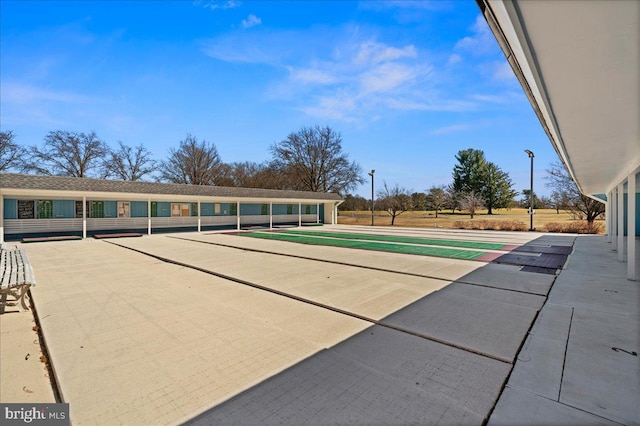 view of community with shuffleboard