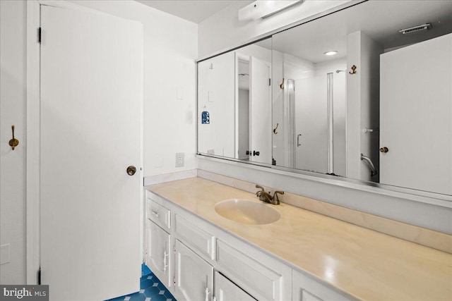 bathroom featuring vanity and visible vents