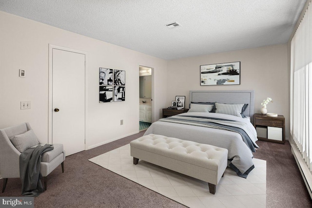 bedroom with ensuite bath, visible vents, carpet flooring, and a textured ceiling