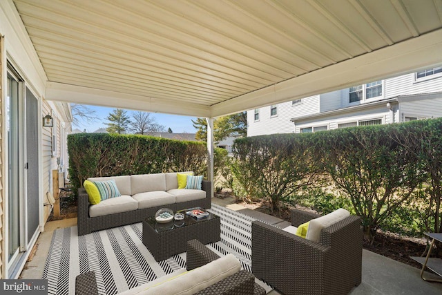 view of patio / terrace featuring an outdoor hangout area and fence