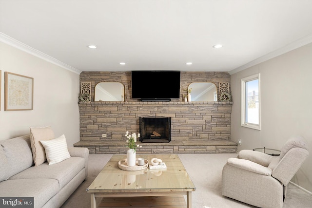 living area featuring recessed lighting, a fireplace, and crown molding