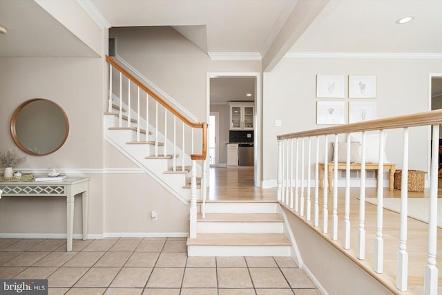 staircase featuring recessed lighting, baseboards, ornamental molding, and tile patterned flooring