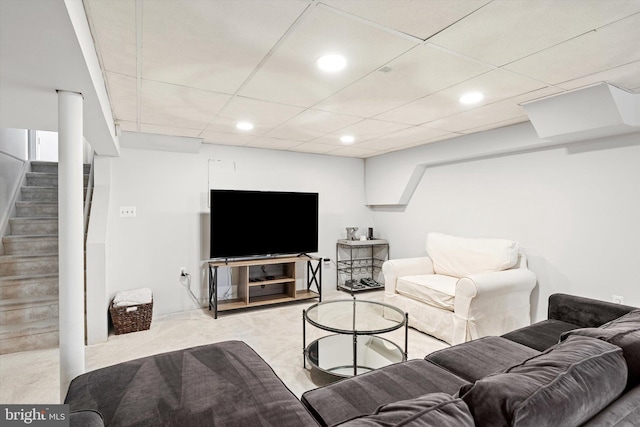 living room featuring carpet flooring, recessed lighting, stairs, and a paneled ceiling