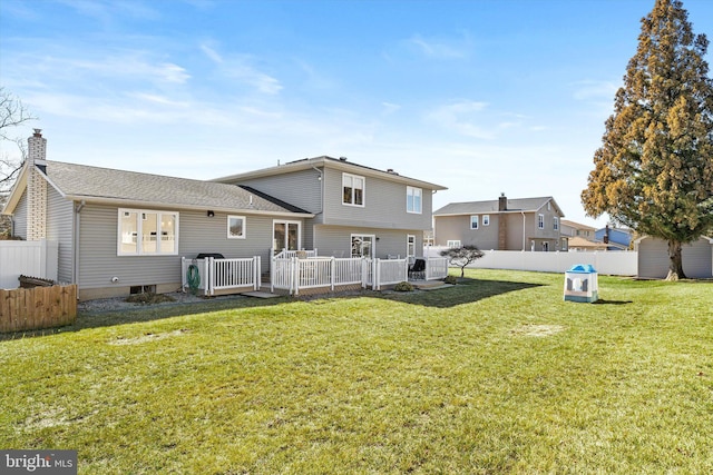 rear view of property with a yard, fence, cooling unit, and a chimney