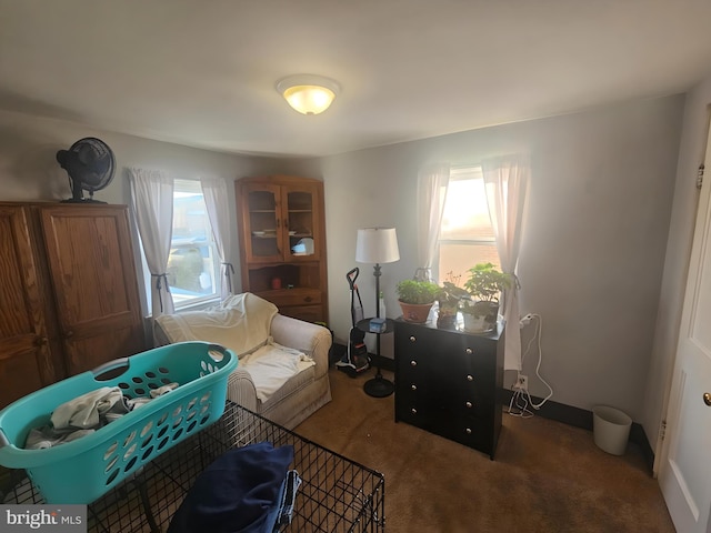 carpeted bedroom featuring baseboards