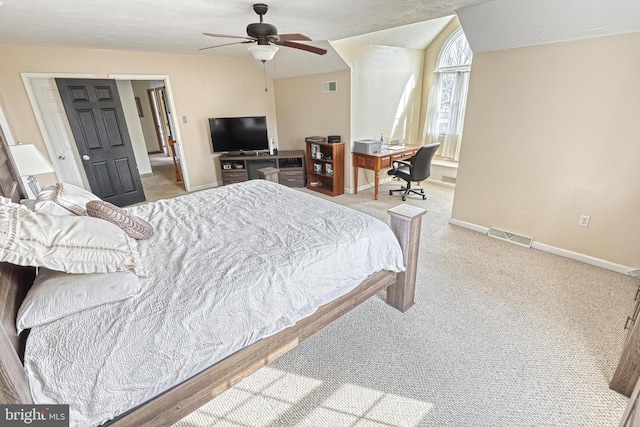 carpeted bedroom with visible vents, baseboards, lofted ceiling, and ceiling fan