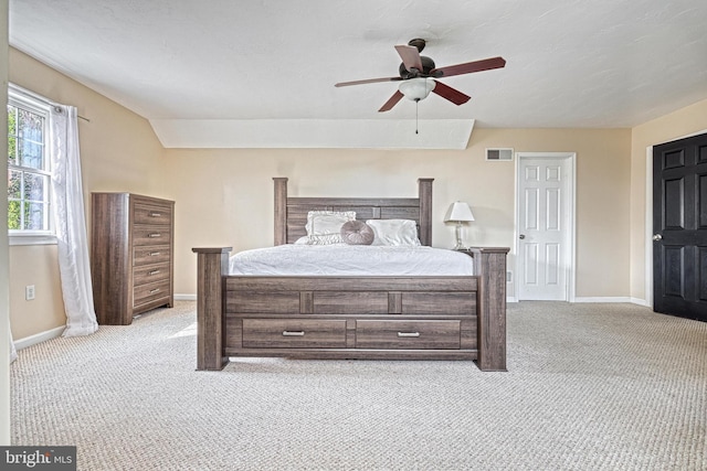 bedroom with light colored carpet, visible vents, and baseboards