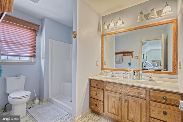 ensuite bathroom featuring ensuite bath, toilet, double vanity, and a sink