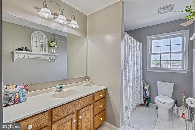 full bath featuring vanity, baseboards, visible vents, curtained shower, and toilet