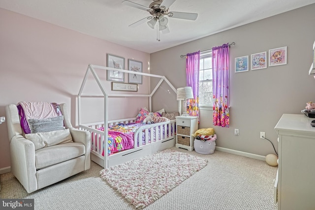 carpeted bedroom with baseboards and a ceiling fan