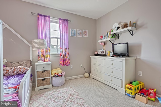 bedroom with baseboards and carpet floors