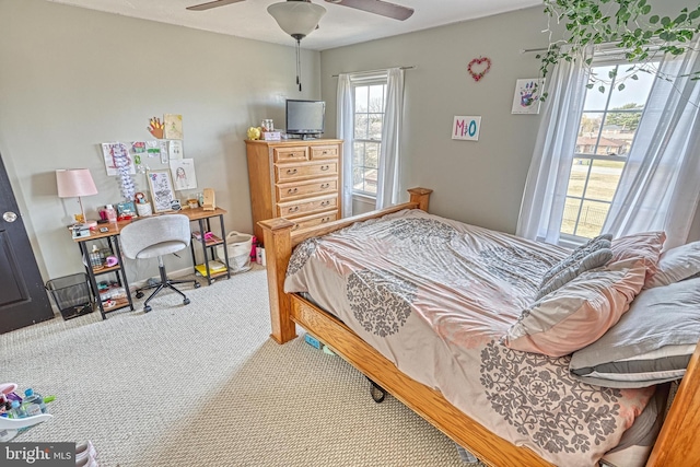 carpeted bedroom with a ceiling fan